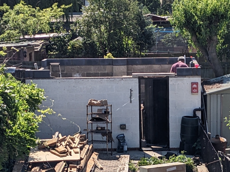 Exterior view of the concrete block walls being refurbished.